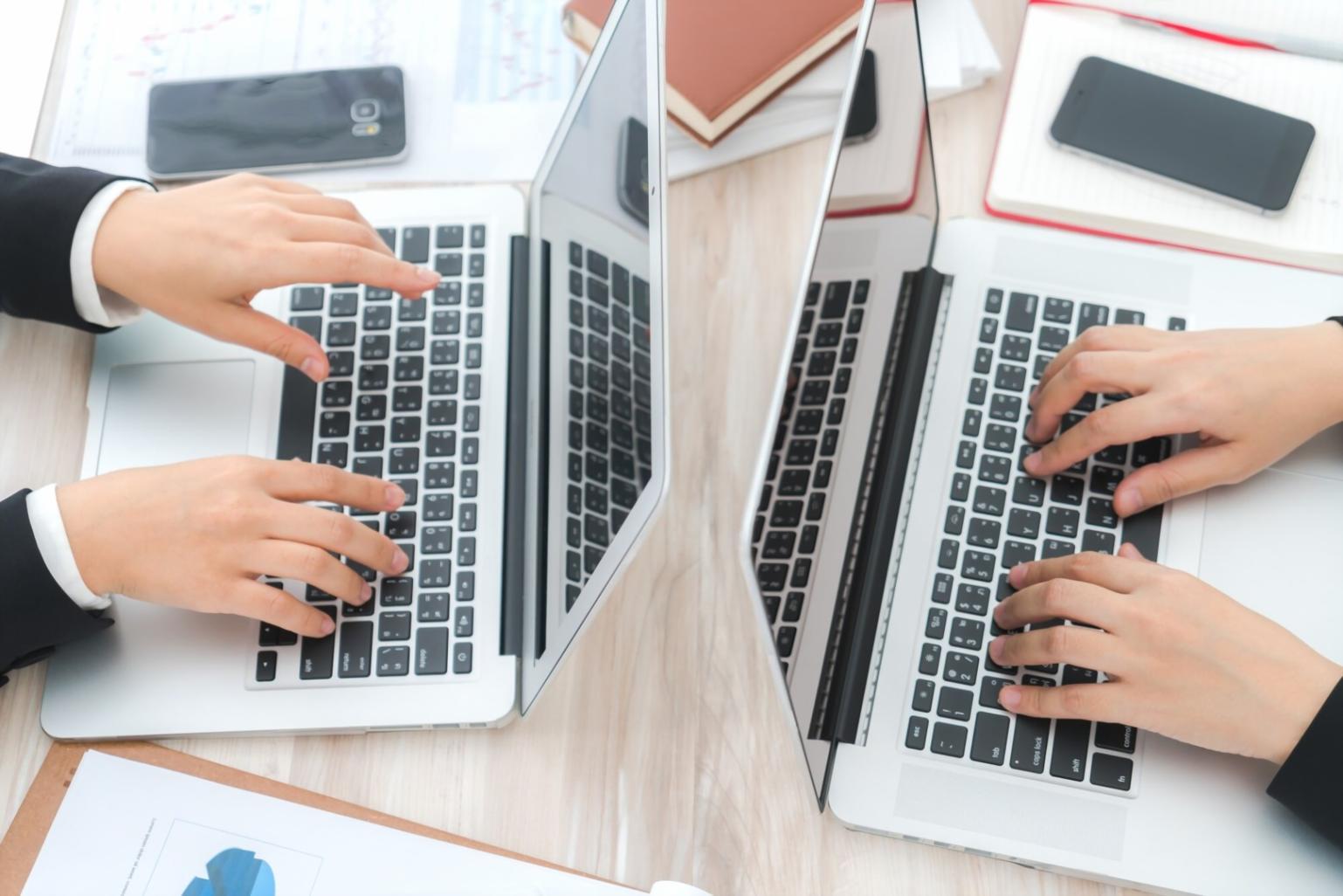 Professional barber workshop environment with students practicing techniques